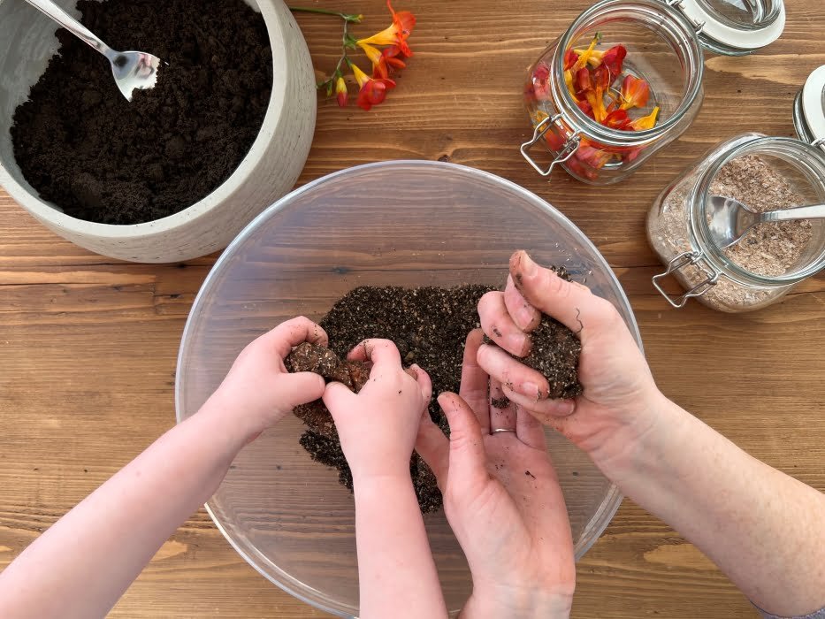 Make Seed Bombs Step 2 – Add water and mix with your hands